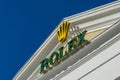 Rolex logo with gold crown on light pediment of Grand Marina shopping gallery building near Commercial seaport Royalty Free Stock Photo