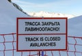 Sochi, Russia - January 7, 2018: No skiing track closed avalanche danger information sign in Gorky Gorod ski resort on snowy winte