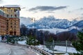 Sochi, Russia - January 6, 2018: Twilight townscape of Gorky Gorod mountain ski resort on snowy mountain peak background