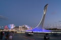 Sochi, Russia 21 July 2022: Sochi Olympic Park. The Olympic flame bowl. Fountain. Evening illumination. Fisht Stadium.