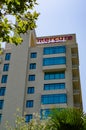 Hotel side facade with green glass