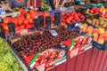 Sochi, Russia - July 26, 2008: Variety of ripe fresh fruits and berries sell at a street market. Shopdoard view