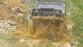 Sochi, Russia 5 June: Car wheel on a dirt road. Off-road tire covered with mud, dirt terrain. Outdoor, adventures and