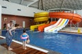 The Mountain Beach Water Park in Gorky Gorod resort in Sochi. Interior view with people bathing in pool by