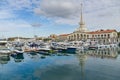 Commercial seaport of Sochi. City center with spike of main building tower Marine Station. Royalty Free Stock Photo