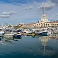 Commercial seaport of Sochi. City center with spike of main building tower Marine Station.