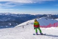 Sochi, Russia, 10-01-2018. Rosa Khutor ski resort. Snowboarder are preparing for the race sitting on top of Rose Peak at an altitu