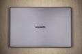 Gray Huawei laptop top view on a gray background close up