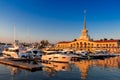 Sochi, Russia - September 03 2020: Seaport building with yachts and boats anchored in the port of Sochi at sunset Royalty Free Stock Photo