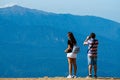 Sochi, Russia, 17 September 2020 - young man and woman standing on observation deck in mountains back to the camera, travel Royalty Free Stock Photo