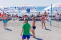 Sochi, Russia - September 07, 2019: Young people playing volleyball on the beach. Team sport and activity on vacation Royalty Free Stock Photo