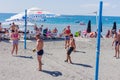 Sochi, Russia - September 07, 2019: Young people playing volleyball on the beach. Team sport and activity on vacation Royalty Free Stock Photo