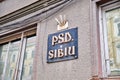 Social Democratic Party PSD / Partidul Social Democrat logo on their former location in Sibiu. Empty flag holders above.