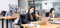 Social distance office with business team wear face mask as new normal life Royalty Free Stock Photo