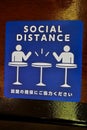 Social Distance word sticker on the table