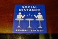 Social Distance word sticker on the table