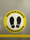 Social distancing. Footprint sign on floor. Keep the 2 meter distance. Coronovirus epidemic protective.