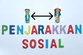 Social distancing mean penjarakan sosial in Malay language with icon over white background