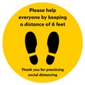 Social Distancing or Safe Distancing Floor Sticker for stores and supermarkets to help reduce the spread of covid-19 coronavirus. Royalty Free Stock Photo