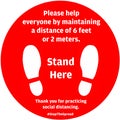 Social Distancing or Safe Distancing Floor Sticker in red color for stores and supermarkets to help reduce the spread of covid-19 Royalty Free Stock Photo