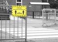 Social distancing sign at school playground road crossing
