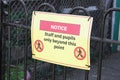 Social distancing sign at school playground road crossing