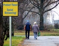 Social Distancing. Yellow square sign. COVID-19 threat