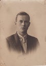 Vintage black and white photo of handsome young man 1900s