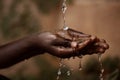 Social Issues: Water Pouring in African Child`s Hands Royalty Free Stock Photo