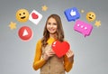 teenage girl with red heart and internet icons Royalty Free Stock Photo