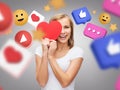 smiling woman with red heart and internet icons Royalty Free Stock Photo