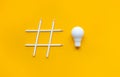 Social media and creativity concepts with Hashtag sign made of pencil and lightbulb