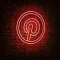 Pinterest icon with a form neon lamp hanging in the wall