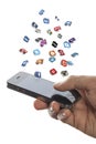 Social media icons fly off the iphone in hand Royalty Free Stock Photo