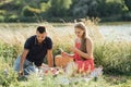 Social media internet addiction, phubbing. Young couple reading social media on their smart phones while having dating Royalty Free Stock Photo