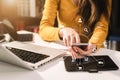 Women typing keyboard with laptop computer and smart phone. Royalty Free Stock Photo