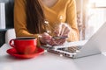 Social media and Marketing virtual icons screen of business women typing keyboard with laptop computer and smart phone. Royalty Free Stock Photo