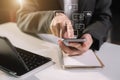 Social media and Marketing virtual icons screen of businessman typing keyboard with laptop computer and smart phone. Royalty Free Stock Photo