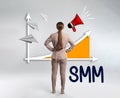 Social media marketing. Young woman in business attire, abbreviation SMM and chart on light grey background