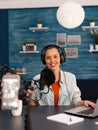 Social media star woman holding professional microphone while recording podcast for youtube channel Royalty Free Stock Photo