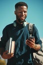 Social media, student and black man with a phone at a college for communication, contact and mobile app. Studying, smile