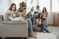 Social networks, friendship, technology and children concept. Group of teenage with phones and tablets and headphones Royalty Free Stock Photo