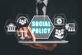 Business person using digital tablet with social policy icon on virtual screen Royalty Free Stock Photo