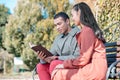 Attentive brunette man reading Bible to his friend Royalty Free Stock Photo