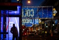 A social poster on Oxford Street, a major road in the City of Westminster in the West End of London