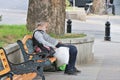 Tbilisi, Georgia. A homeless sleeps in a bench near the city center.