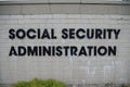 Social security administration sign on white brick Royalty Free Stock Photo
