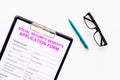 Social security benefits. Application form near pen and glasses on white background top view space for text Royalty Free Stock Photo