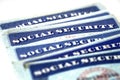 Social Security Cards in a Row Pile for Retirement Royalty Free Stock Photo