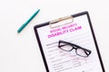 Social security. Disability claim form near glasses on white background top view space for text Royalty Free Stock Photo